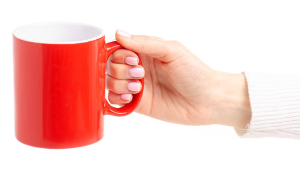 istock Red cup mug in female hand 1087597548
