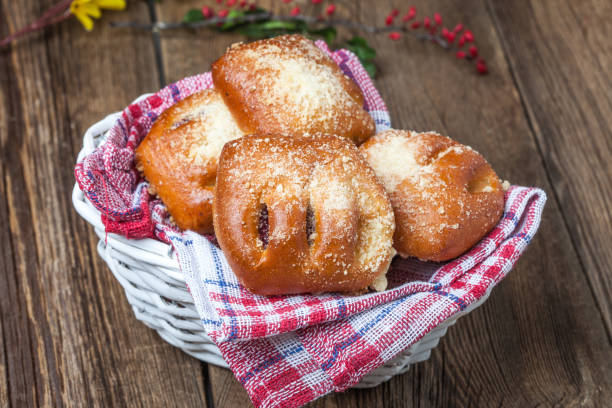 istock Buns with berries on a wooden table. 1087604770