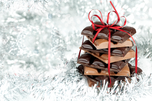 Christmas chocolate stack present on a fluffy background