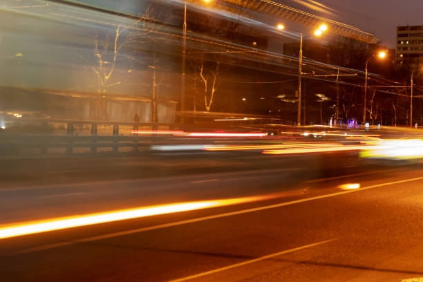 istock City car night lights perspective blurred by high speed, light trails background 1087612880