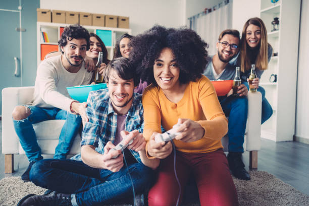 istock Colleagues playing video games in the office relax room 1087619458