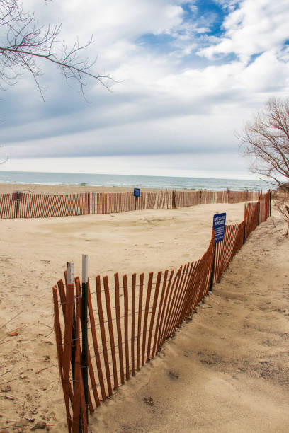 istock red wooden fence on a beach 1087624392