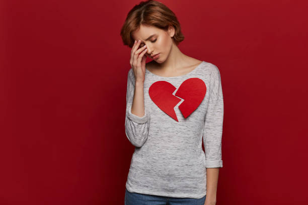 Sad single girl with big broken heart, had down. Valentine's day and love concept Sad single girl with big broken heart, had down. Valentine's day and love concept ex girlfriend stock pictures, royalty-free photos & images