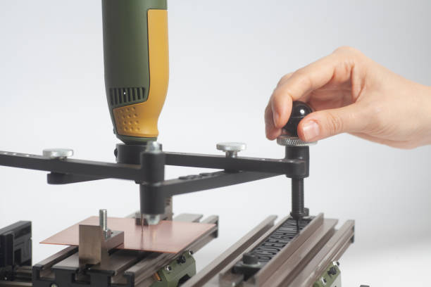 istock Worker hands on Engraving device pantograph with CNC engraver with letterpress alphabet 1087626740