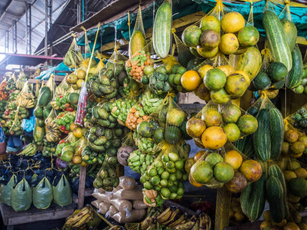 Vintage photo of melons, pineapples, mango at a food market