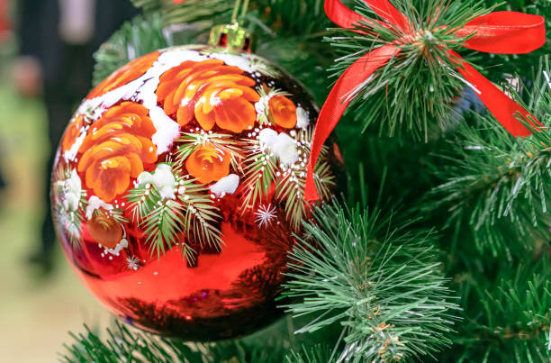 istock Colorful Christmas ball with a floral pattern on the Christmas tree. 1087634244