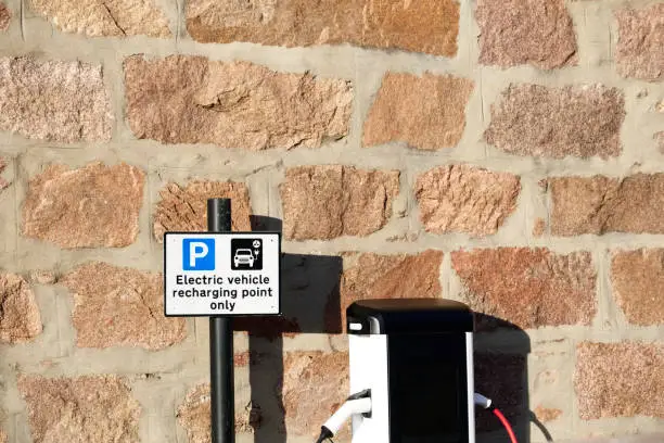 Electric charging point for vehicles cars bikes free no charge operated in shopping mall retail park in car parking space uk