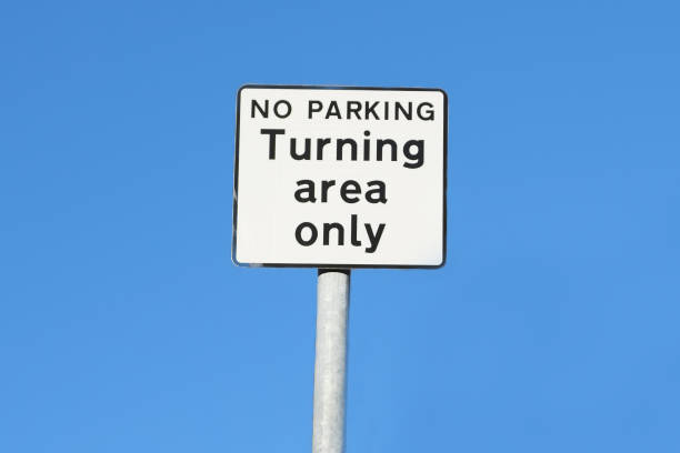 istock Turning area only no parking sign against blue sky 1087638354