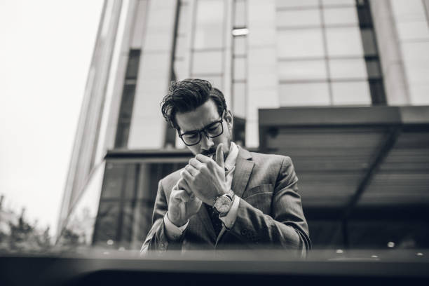 istock Businessman lighting up a cigarette 1087640042