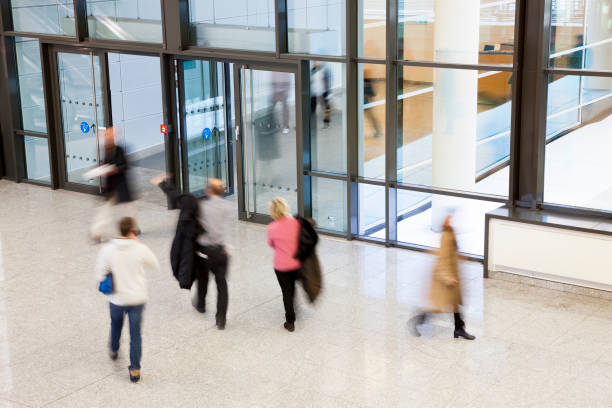 istock Group of Employers Walking in Modern Building Interior 1087642088