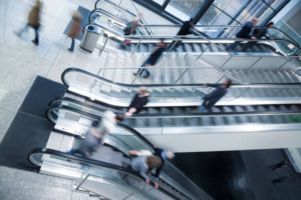 istock Group of Blurred People on Escalator and Stairs 1087642136