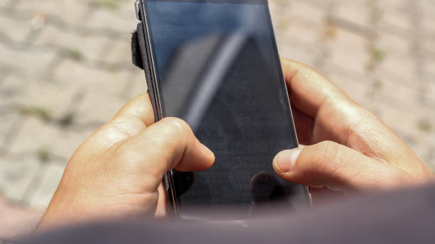 istock Hand in the phone 1087647300