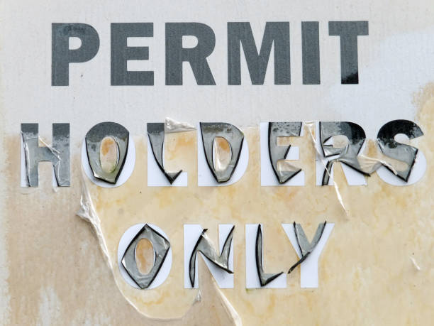 istock faded parking sign on an abandoned building 1087657988