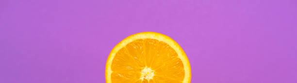 istock Banner orange One is Tropical Fruit Background Ultraviolet 1087664428