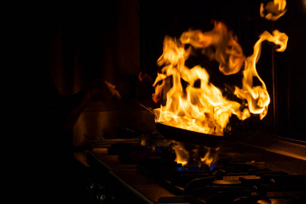 istock Chef flaming food at a restaurant 1087664678
