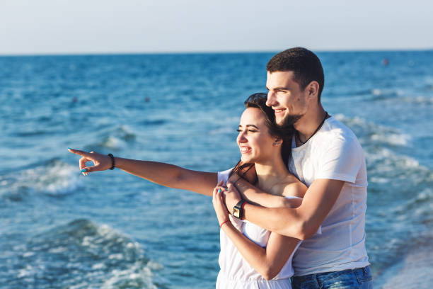 istock Young happy couple on a sea holiday. 1087664732