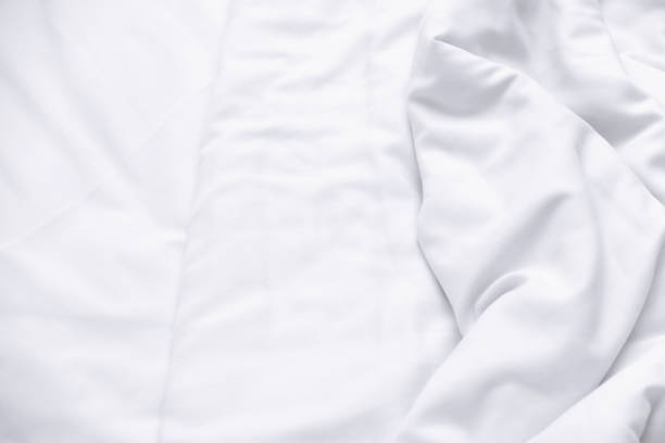 istock White delicate soft background of fabric or bedding sheet 1087664910