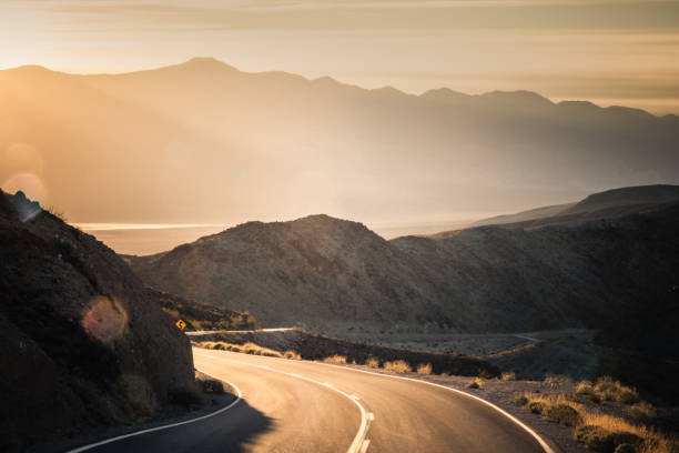 istock Highway at sunrise, going into Death Valley National Park 1087673434