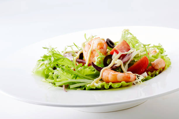 istock Delicious shrimp salad on a white background 1087673824