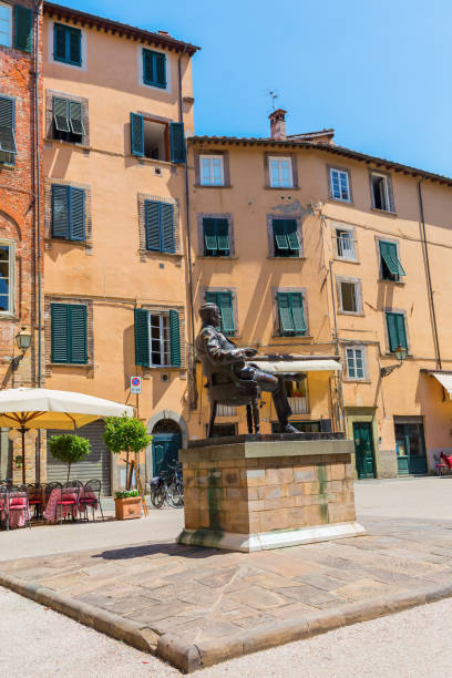 statue of Giacomo Puccini in front of his birthplace in Lucca, Italy Lucca, Italy - July 01, 2016: statue of Giacomo Puccini in front of his birthplace in Lucca. He was an Italian opera composer who has been called -the greatest composer of Italian opera after Verdi- giacomo puccini stock pictures, royalty-free photos & images