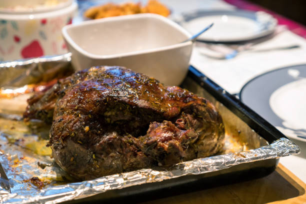 istock A roast leg of lamb on baking tray on christmas table 1087680046