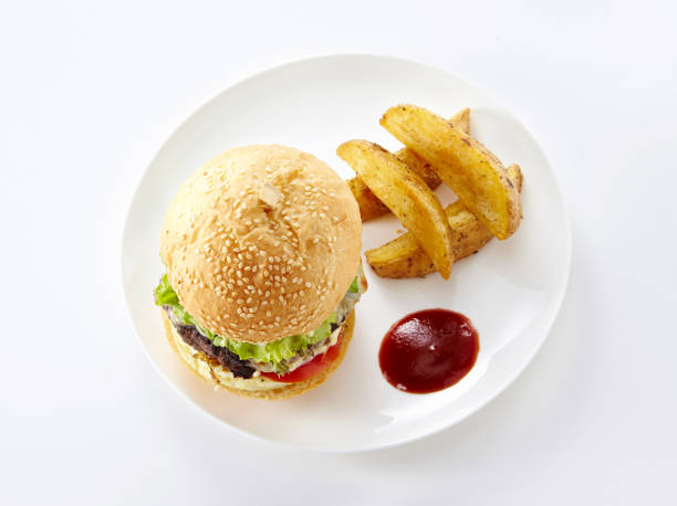 istock Delicious sandwich and big fries on a white background 1087681640