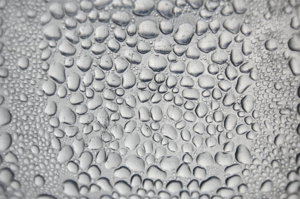 istock Background and wallpaper by rainy drop and water drops on window glass. 1087686936