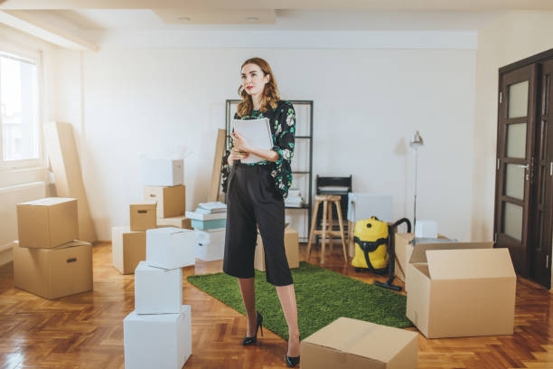 istock Lovely modern real estate agent in a unpacked apartment 1087693098