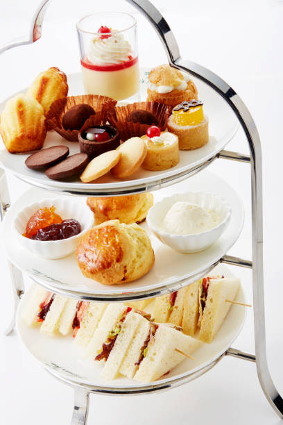 istock Delicate and delicious afternoon tea pastry mix on a white background 1087710256