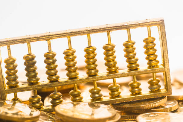 istock The gold abacus is placed on gold COINS 1087713748