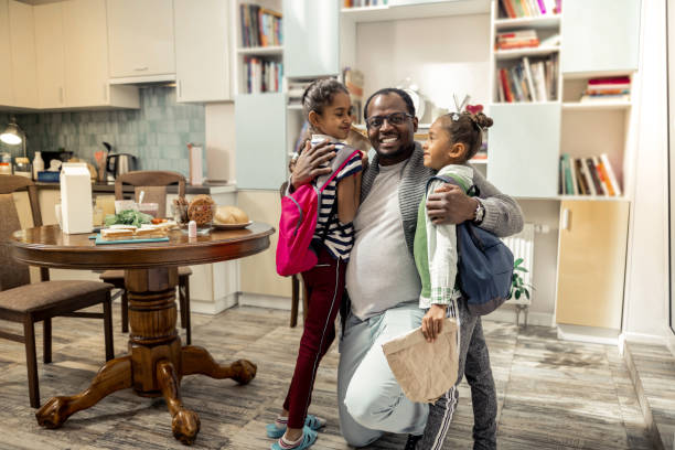 istock Father feeling happy after family breakfast together with daughters 1087718754