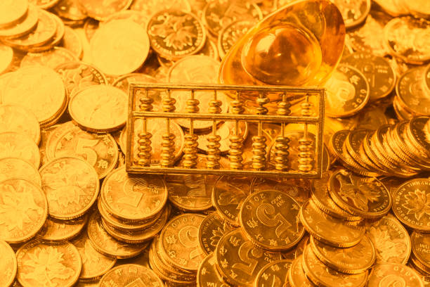 istock The gold abacus is placed on gold COINS 1087723752
