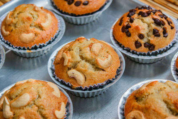 istock Homemade banana cupcake with wood background. 1087735886