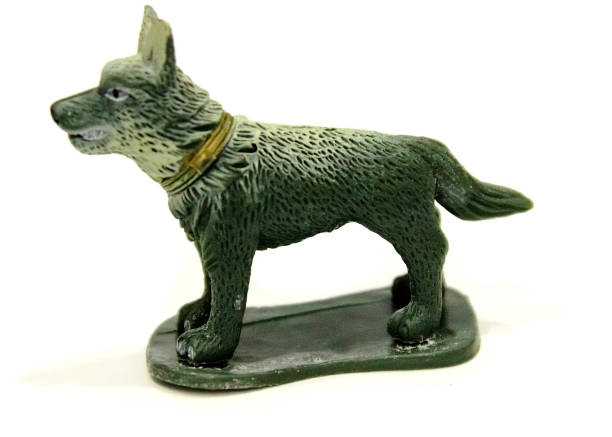 istock little beautiful toy plastic dog on a white background 1087746386