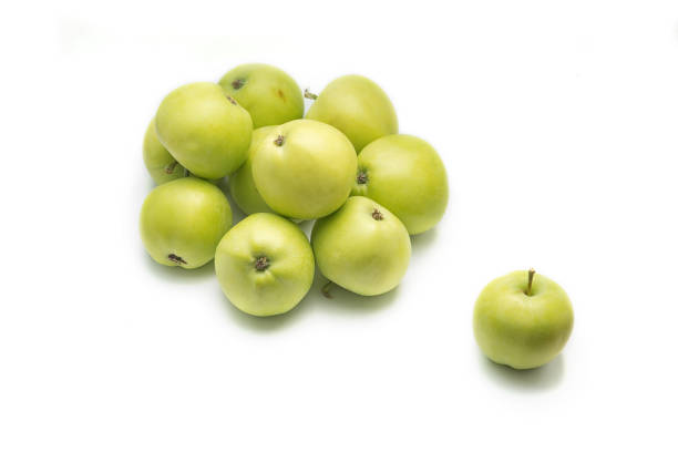 istock Green apples a bunch isolated on the white background with the shadow. 1087757576