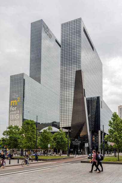 Rotterdam, Netherlands - May 22, 2018: Modern and majestic Gebouw Delftse Poort (Delft Gate Building) office skyscraper with facade made of maintenance free, blue coloured reflective glass.