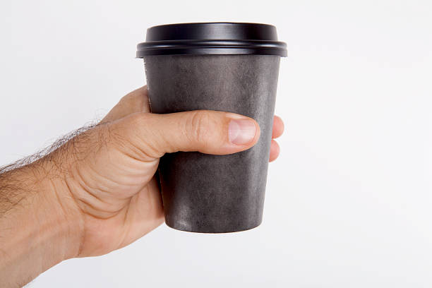istock Young man is drinking coffee over white background. 1087779918