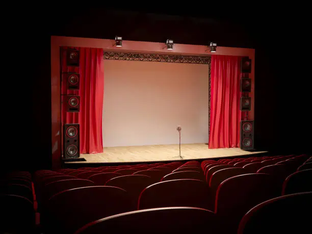Concert hall with a red curtain and a microphone on the counter. 3d illustration