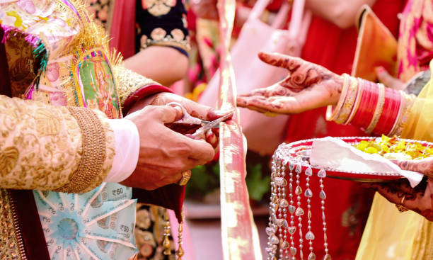istock Cutting Ribbon in Indian Wedding Ritual Welcome Ceremony 1087788108