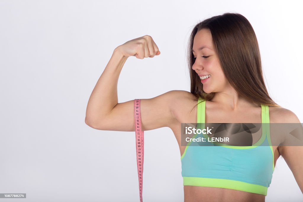Fitness Woman With Measuring Tape On Biceps Muscle Stock Photo - Download  Image Now - Adhesive Tape, Adult, Adults Only - iStock