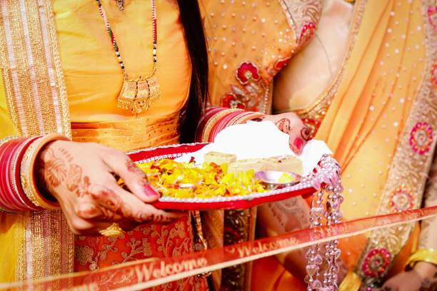 istock Cutting Ribbon in Indian Wedding Ritual Welcome Ceremony 1087792408
