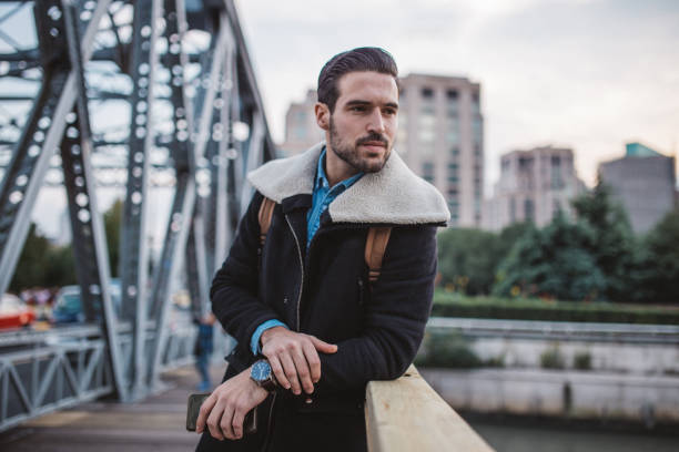 istock Cute guy enjoys a new city 1087792528