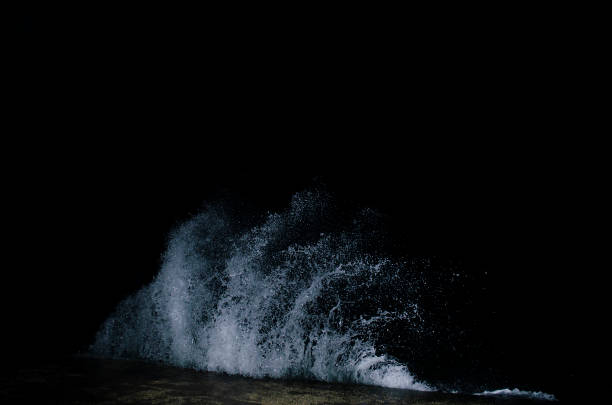 Splashing wave on the Black sea in the night.