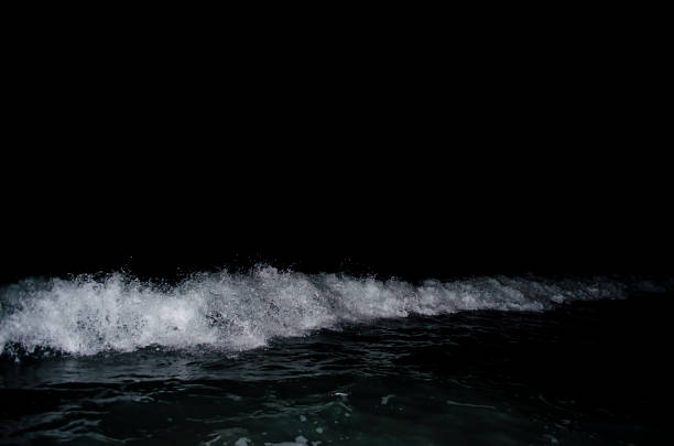 Splashing wave on the Black sea in the night.