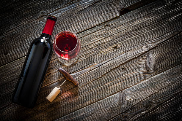 istock Wineglass, wine bottle, vintage corkscrew and cork stopper 1087803902