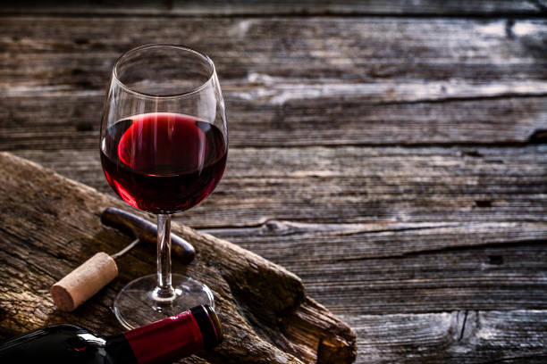 istock Wineglass, wine bottle, vintage corkscrew and cork stopper 1087803910