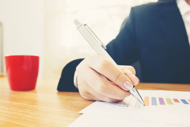 istock businesswoman  hands checking data report chart 1087807170