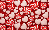 Valentine's Day Concept- Candy Like Red And White Heart Shapes On Red Background