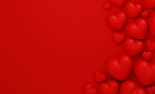 Red heart shapes on red background. Horizontal composition with  copy space.