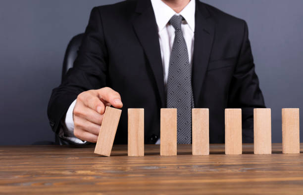 istock Just Starting Or Letting Domino Toppling Effect 1087813300